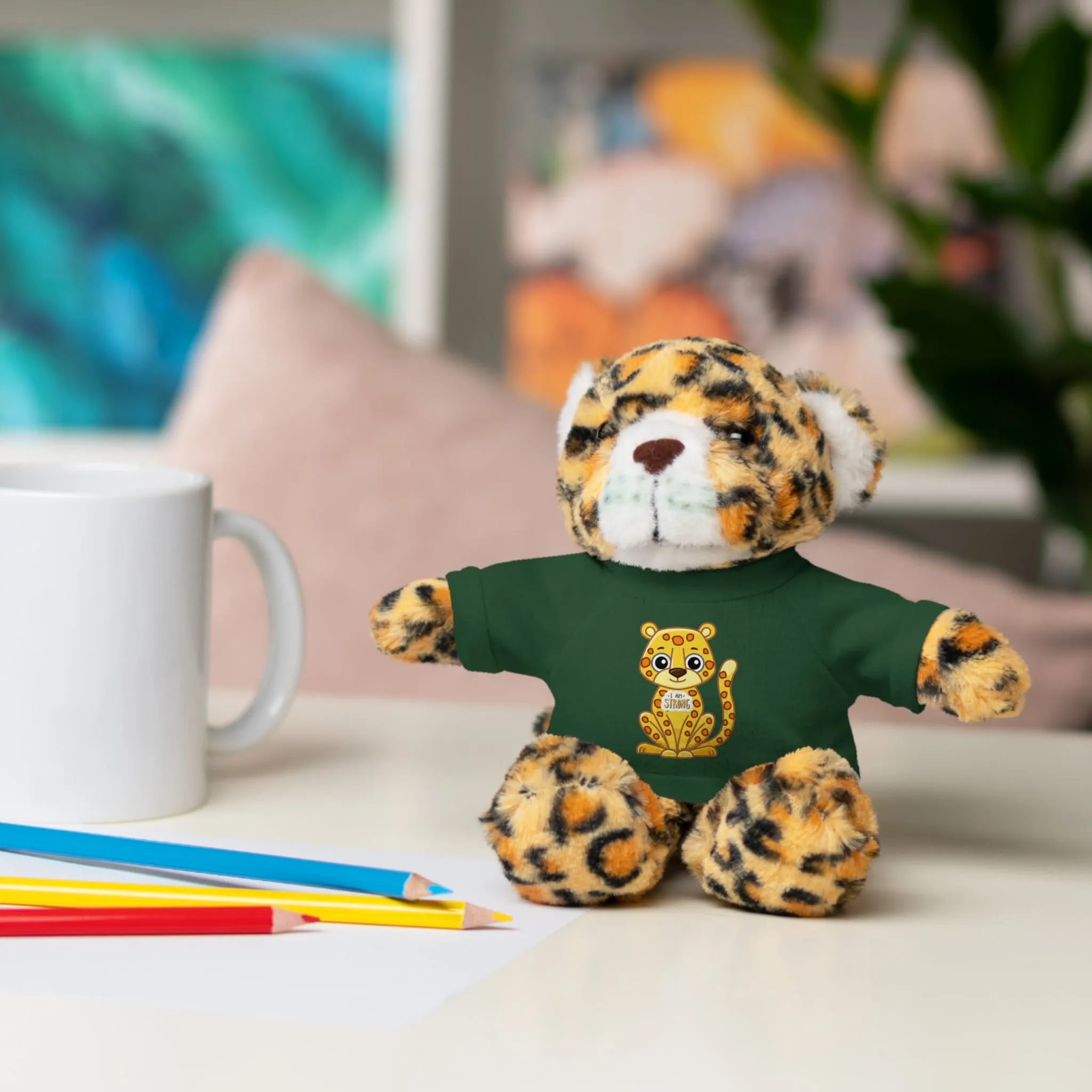 Jaguar Stuffie wears a shirt with a Jaguar 'I am Strong' Cool Stuff Stuffies